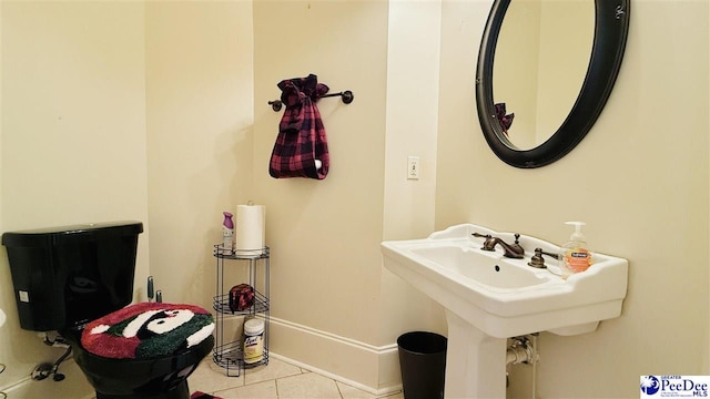 bathroom featuring sink and tile patterned floors