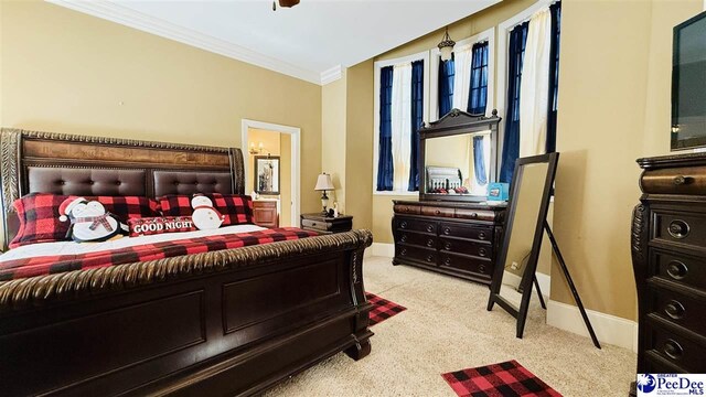 carpeted bedroom with crown molding