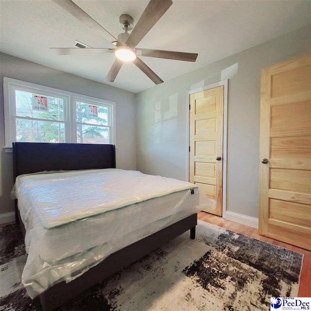 139 Wingate Ave, Florence, SC 29506 - bedroom featuring light wood-type flooring, ceiling fan, and baseboards