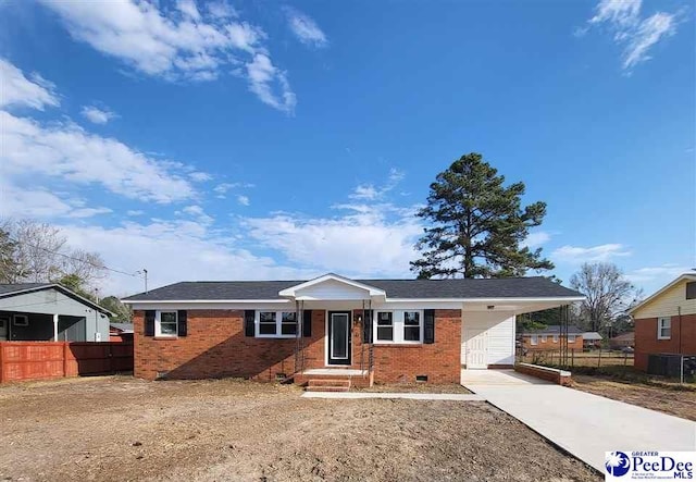 single story home with crawl space, driveway, fence, and brick siding