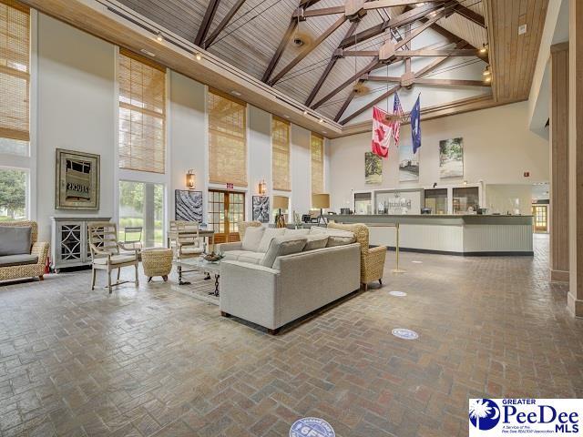 living room featuring high vaulted ceiling, beamed ceiling, and wood ceiling