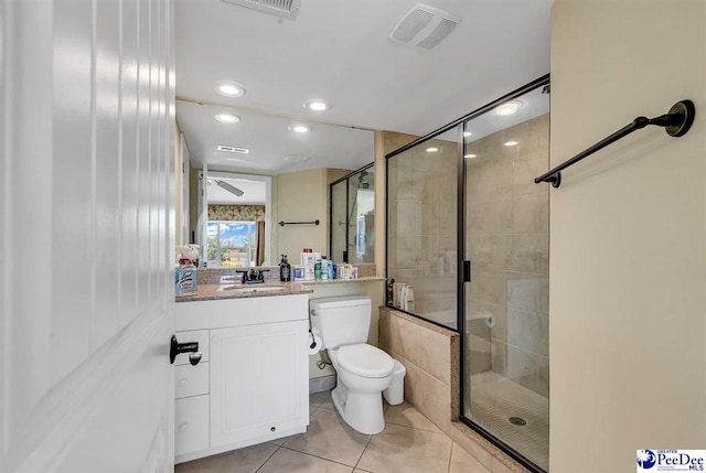 bathroom with toilet, tile patterned floors, visible vents, and a stall shower