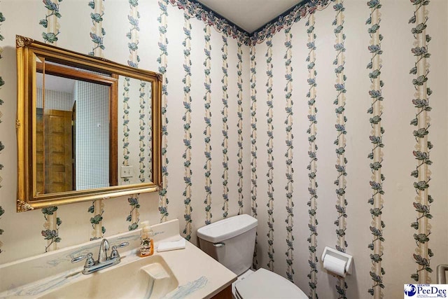 bathroom with vanity and toilet