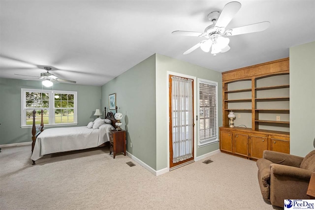 bedroom featuring light carpet and ceiling fan