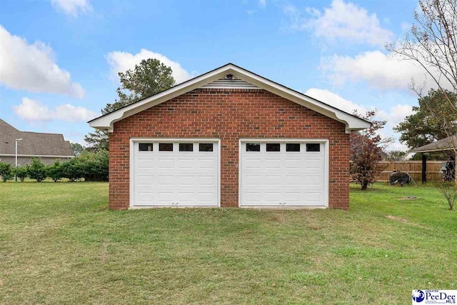 garage featuring a lawn