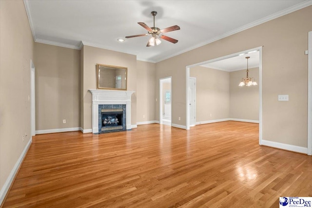 unfurnished living room with light wood-type flooring, ceiling fan with notable chandelier, and a tile fireplace