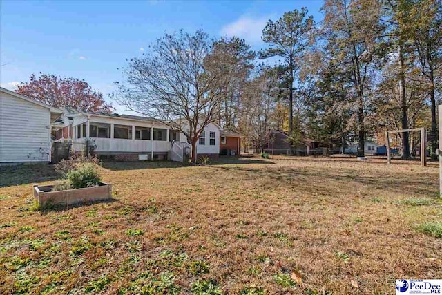 view of yard featuring a sunroom