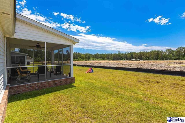 3209 Haven Straits, Florence, SC 29505 - view of grassy yard with a sunroom and ceiling fan