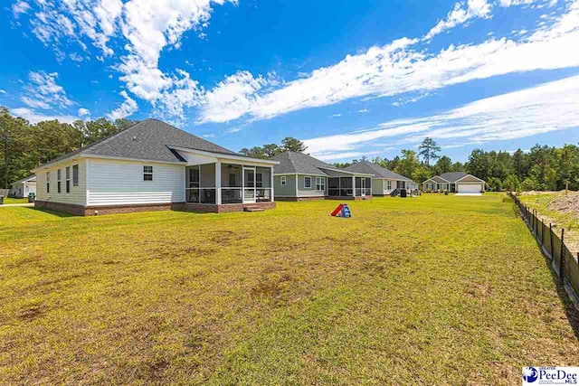 3209 Haven Straits, Florence, SC 29505 - rear view of property featuring a sunroom