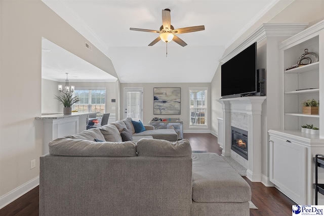 3209 Haven Straits, Florence, SC 29505 - living area featuring a fireplace with flush hearth, plenty of natural light, a ceiling fan, and dark wood-type flooring