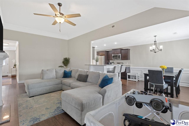 3209 Haven Straits, Florence, SC 29505 - living room with a ceiling fan, ornamental molding, dark wood-style floors, a chandelier, and a wainscoted wall