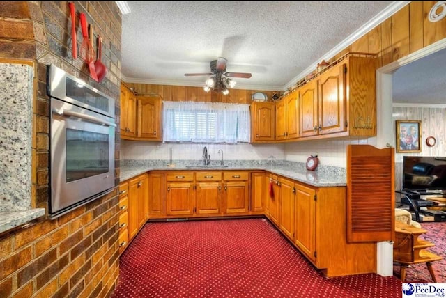 101 E Claff Cir, Lake City, SC 29501 - kitchen featuring ceiling fan, crown molding, a textured ceiling, and stainless steel oven