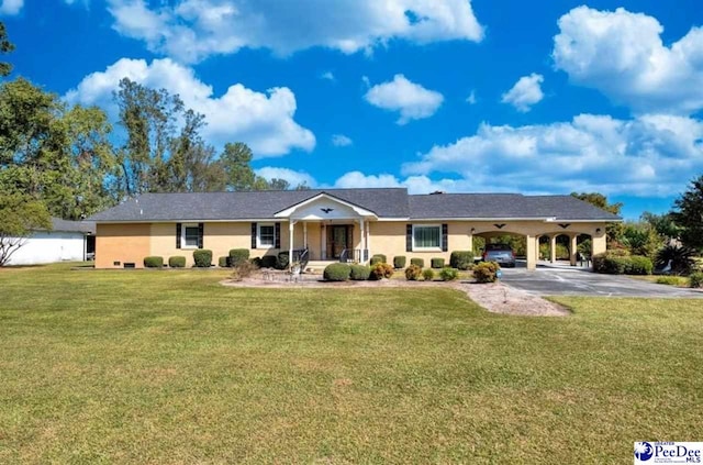 ranch-style home with a front yard and a carport