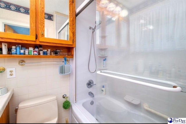 101 E Claff Cir, Lake City, SC 29501 - bathroom with tile walls, toilet, and washtub / shower combination
