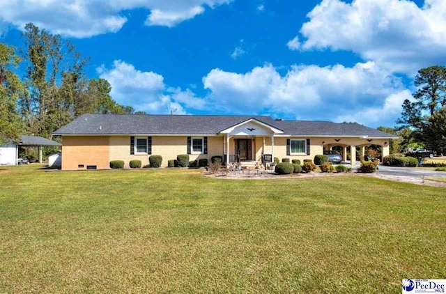 ranch-style home with a carport and a front lawn