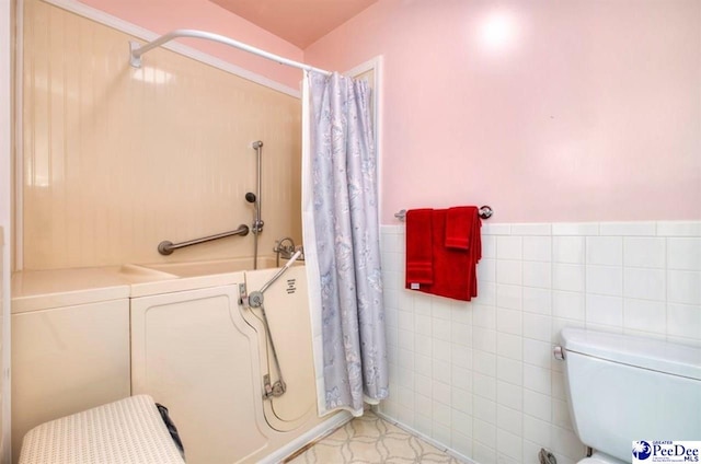101 E Claff Cir, Lake City, SC 29501 - bathroom featuring tile walls and toilet