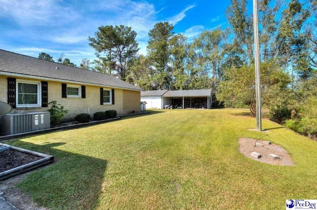 101 E Claff Cir, Lake City, SC 29501 - view of yard featuring cooling unit and a carport