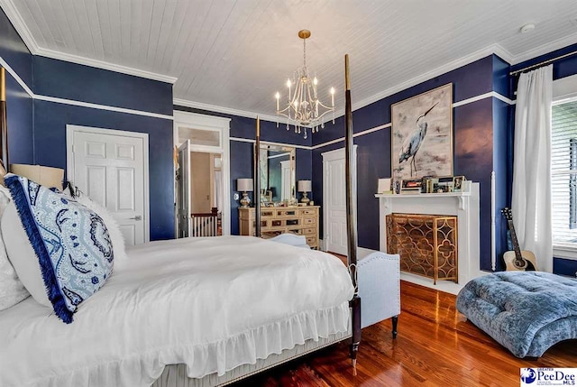 bedroom featuring wood-type flooring, ornamental molding, wooden ceiling, and an inviting chandelier