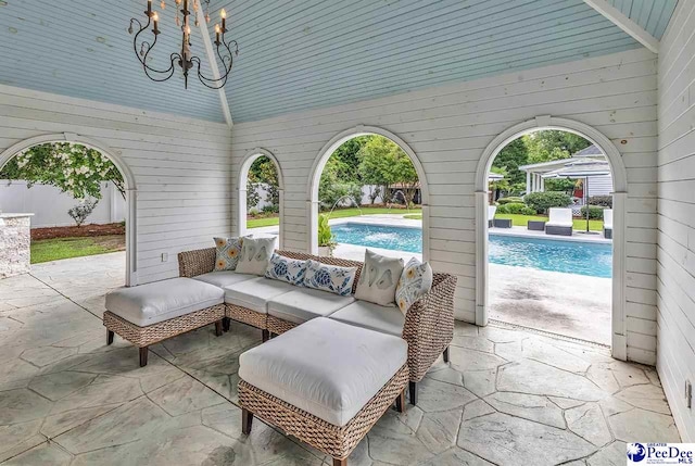 view of patio / terrace featuring a fenced in pool and an outdoor hangout area