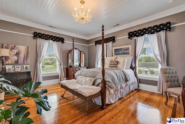 bedroom featuring hardwood / wood-style flooring, crown molding, wood ceiling, and a chandelier