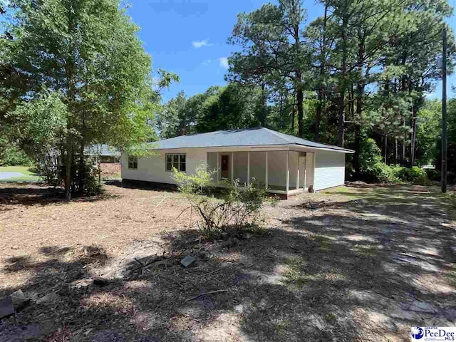 1009 Trailwood Dr, Hartsville, SC 29550 - back of property with a sunroom