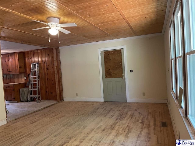 1009 Trailwood Dr, Hartsville, SC 29550 - unfurnished living room featuring baseboards, light wood-style flooring, ceiling fan, wooden ceiling, and healthy amount of natural light