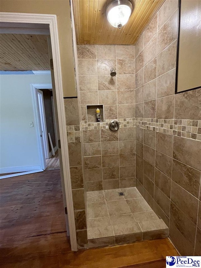 1009 Trailwood Dr, Hartsville, SC 29550 - bathroom with tiled shower, wood ceiling, and wood finished floors