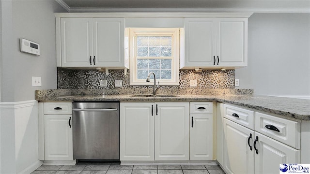 kitchen featuring sink, dishwasher, white cabinetry, light stone counters, and ornamental molding