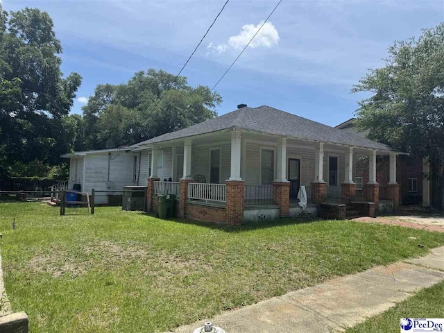 119 Sanders St, Darlington, SC 29532 - view of property exterior featuring a porch and a lawn