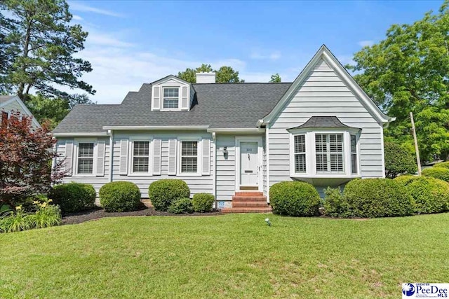 100 Mckellar St, Bennettsville, SC 29512 - cape cod home with a front lawn, a chimney, and roof with shingles