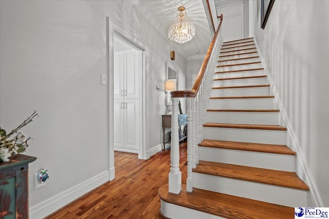 100 Mckellar St, Bennettsville, SC 29512 - stairway with wood finished floors, a chandelier, baseboards, and crown molding