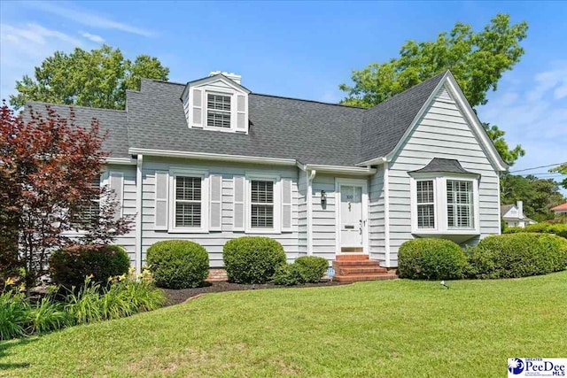100 Mckellar St, Bennettsville, SC 29512 - cape cod-style house featuring a front yard, roof with shingles, and entry steps