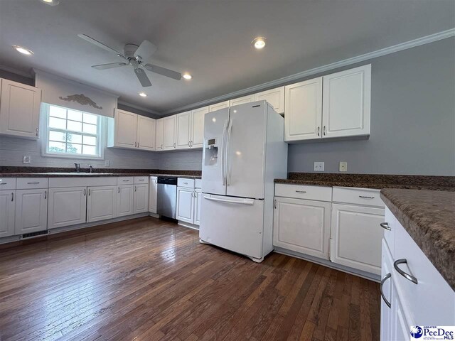 148 High Hill Rd, Lake View, SC 29563 - kitchen with white fridge with ice dispenser, ornamental molding, dark countertops, ceiling fan, and white cabinets