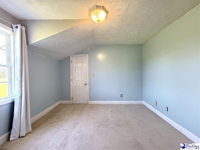 148 High Hill Rd, Lake View, SC 29563 - bonus room with vaulted ceiling, a textured ceiling, and carpet flooring