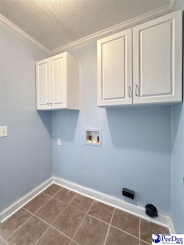 148 High Hill Rd, Lake View, SC 29563 - laundry area featuring cabinet space, hookup for a washing machine, dark tile patterned floors, a textured ceiling, and crown molding