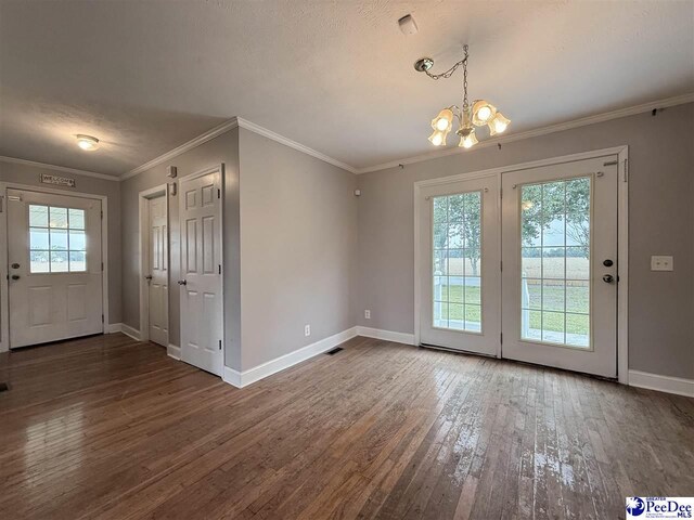 148 High Hill Rd, Lake View, SC 29563 - unfurnished dining area with a chandelier, hardwood / wood-style flooring, and ornamental molding