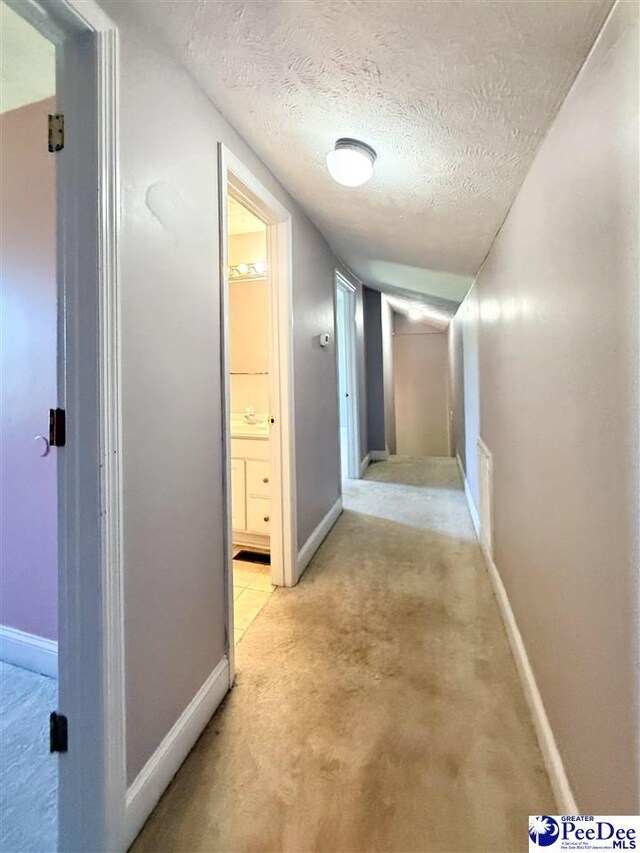 148 High Hill Rd, Lake View, SC 29563 - hallway with light colored carpet and a textured ceiling