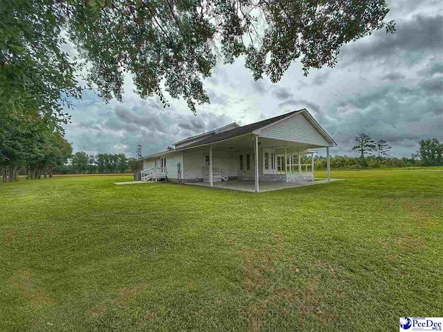 148 High Hill Rd, Lake View, SC 29563 - view of side of property with a patio and a yard