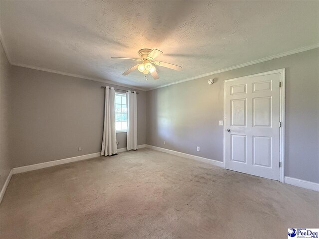 148 High Hill Rd, Lake View, SC 29563 - spare room with ceiling fan, ornamental molding, light carpet, and a textured ceiling