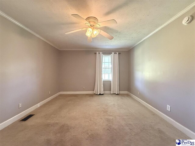 148 High Hill Rd, Lake View, SC 29563 - unfurnished room featuring a textured ceiling, ceiling fan, crown molding, a smoke detector, and light carpet