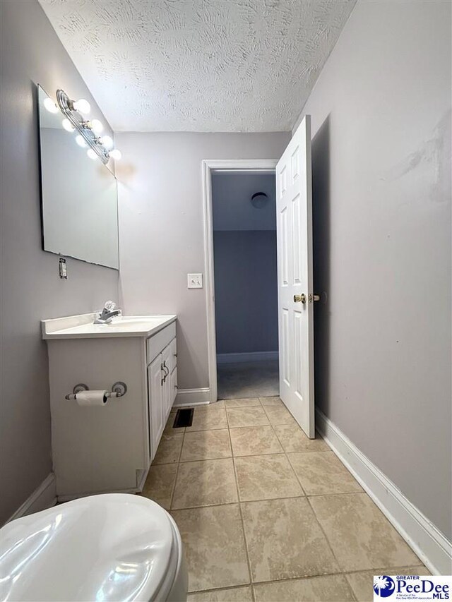 148 High Hill Rd, Lake View, SC 29563 - bathroom featuring vanity, tile patterned flooring, and a textured ceiling