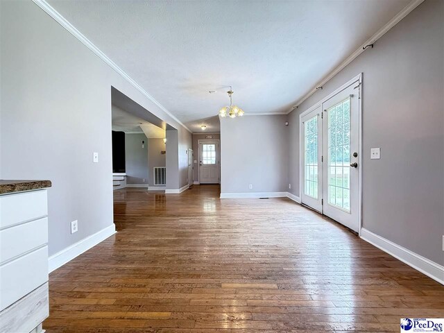 148 High Hill Rd, Lake View, SC 29563 - unfurnished dining area with crown molding, a chandelier, and hardwood / wood-style flooring