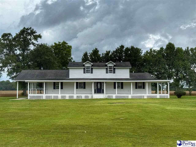 148 High Hill Rd, Lake View, SC 29563 - farmhouse-style home featuring a porch and a front yard