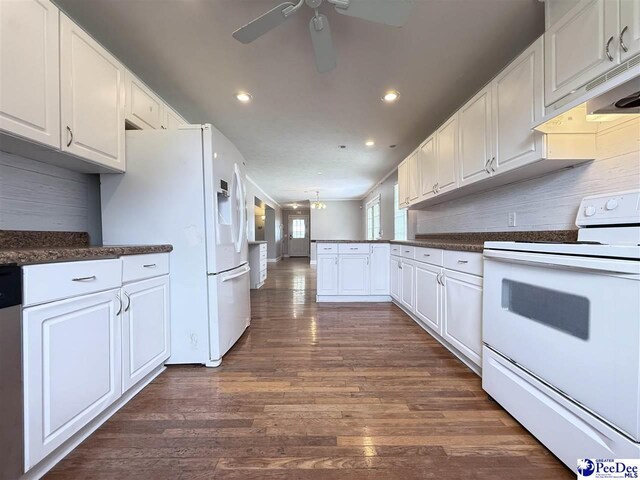 148 High Hill Rd, Lake View, SC 29563 - kitchen with white appliances, a ceiling fan, a peninsula, dark countertops, and dark wood-style floors