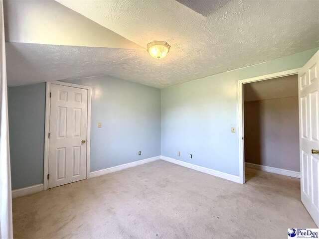 148 High Hill Rd, Lake View, SC 29563 - spare room with carpet, a textured ceiling, and vaulted ceiling