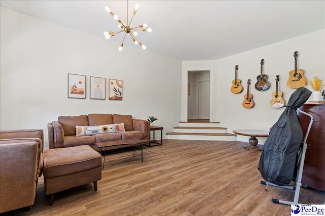 living room with hardwood / wood-style floors and a chandelier