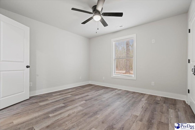 unfurnished room featuring light hardwood / wood-style flooring and ceiling fan