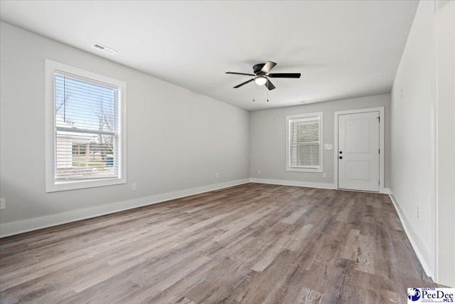 unfurnished room featuring light hardwood / wood-style floors and ceiling fan