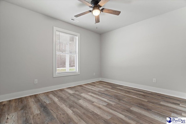 unfurnished room with ceiling fan and hardwood / wood-style floors