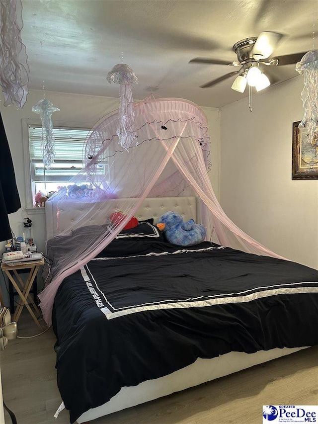 unfurnished bedroom featuring ceiling fan and hardwood / wood-style floors